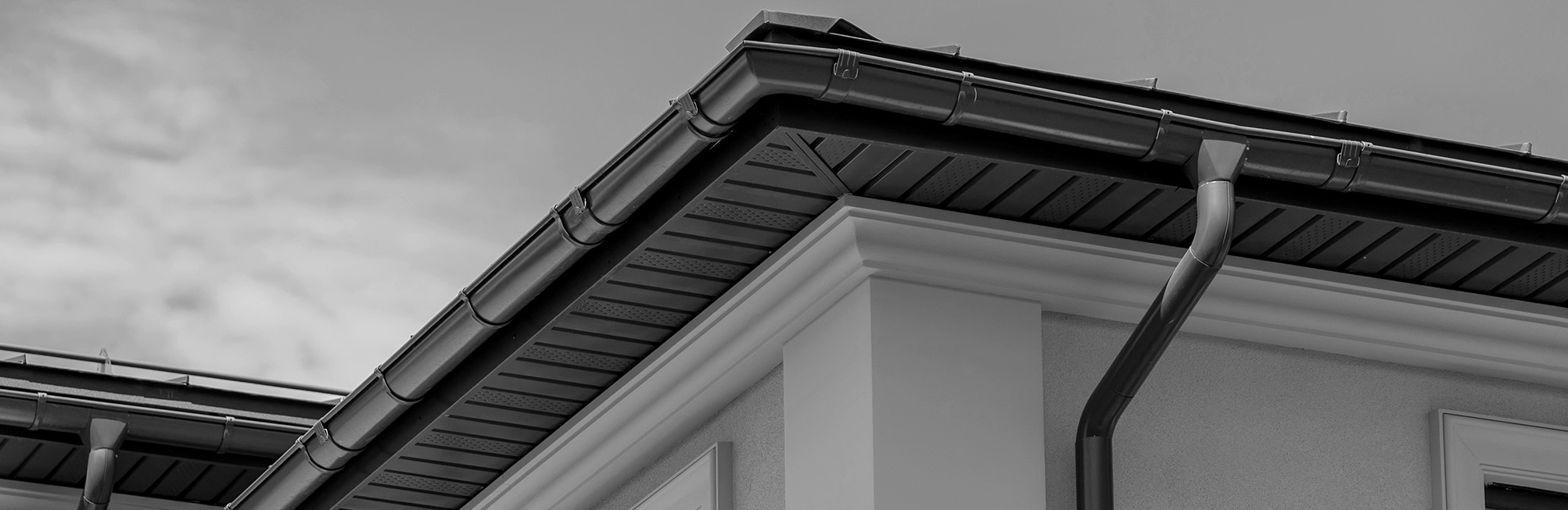Replacement vinyl gutters installed by professional gutter contractors