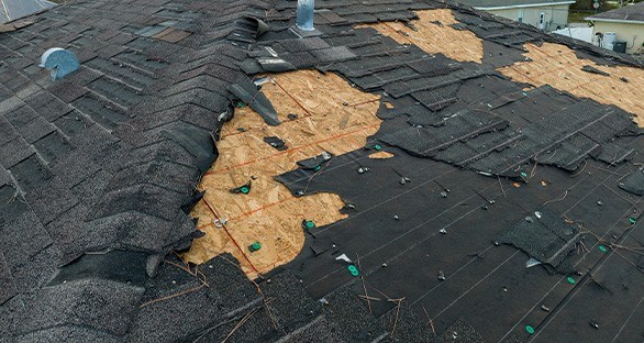 Missing asphalt shingles after storm in Columbus, OH