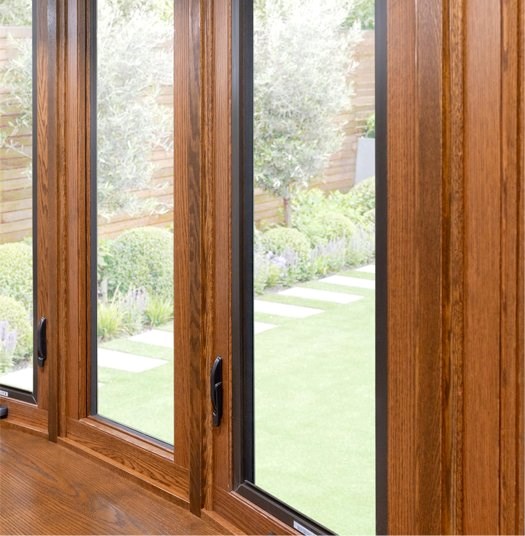 Brown bay window with black handles and clean glass